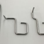 Two small stainless steel wire forms