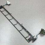 Conveyor track assembly made per customer specifications from wire, plate, and tubing.
