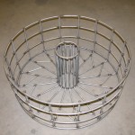 A round basket made for high heat applications such as heat treating metal. Can be constructed of high alloy materials such and Inconel, hastalloy, or 330 grade stainless steel.