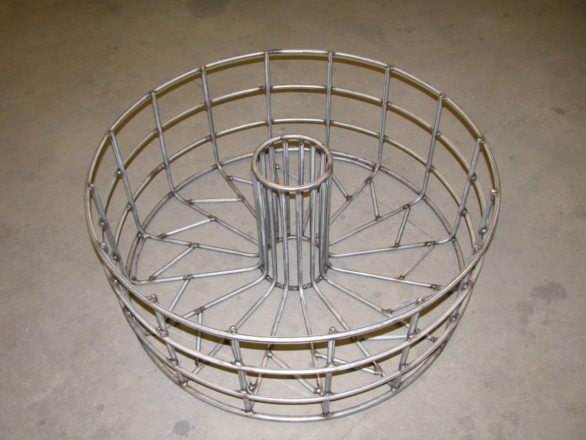 A round basket made for high heat applications such as heat treating metal. Can be constructed of high alloy materials such and Inconel, hastalloy, or 330 grade stainless steel.