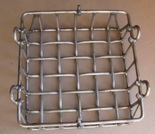 A square heat treat basket with lifting loops created with with forming