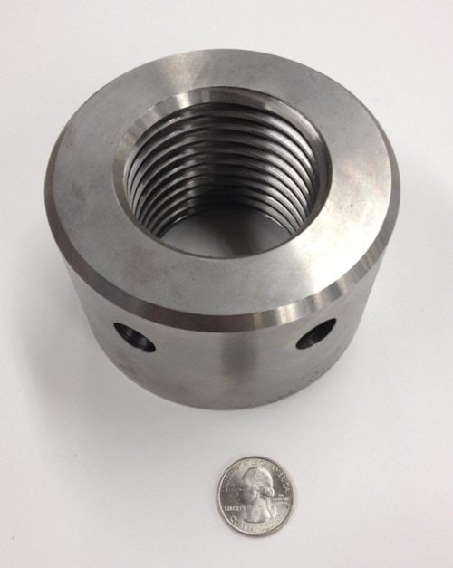 A machined component with an internal acme thread.