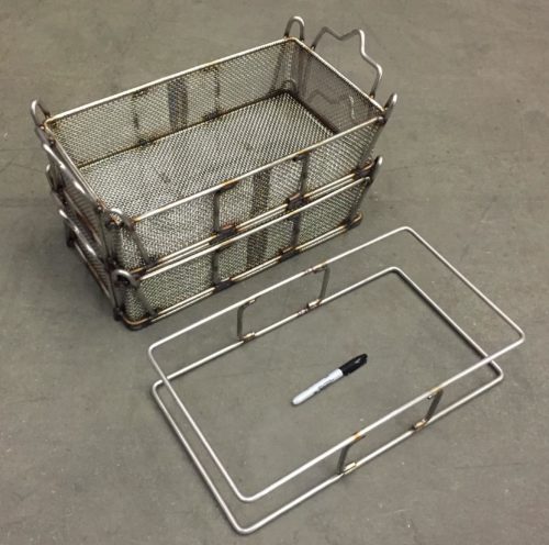 Two stackable wire baskets and an unfinished frame wire forming