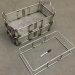 Two stackable wire baskets and an unfinished frame