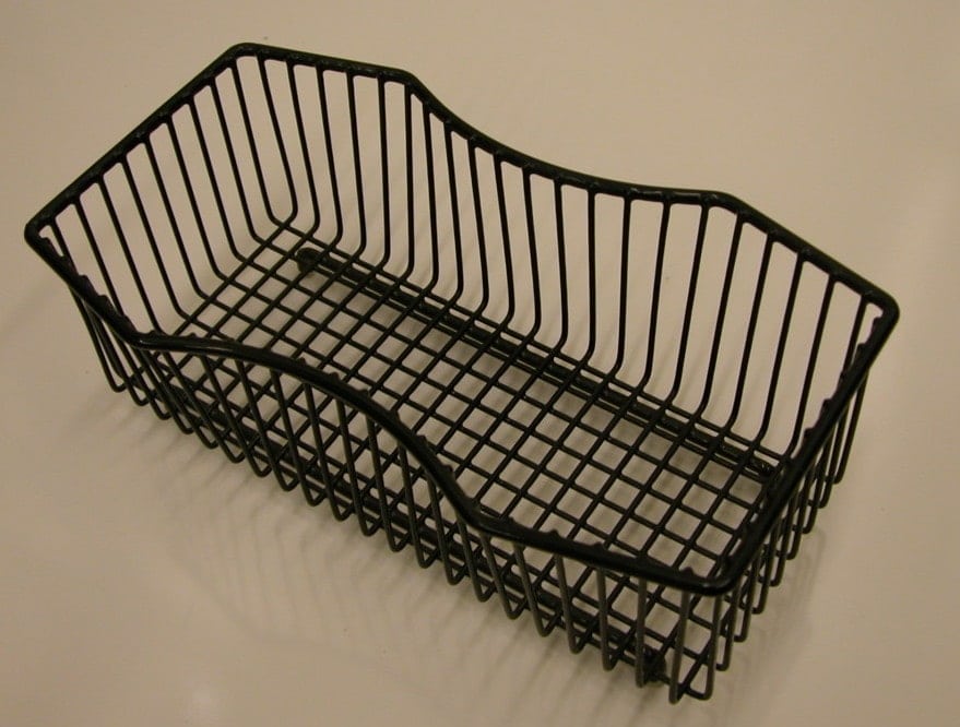 A powdercoated decorative basket with a CNC bent top rim for a unique look.