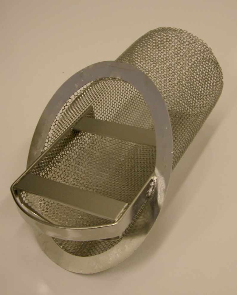 A strainer basket made of 304 stainless steel perforated metal that has been electropolished to a high shine.